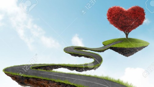 20233218-road-suspended-in-the-sky-towards-the-tree-in-the-shape-of-heart-Stock-Photo